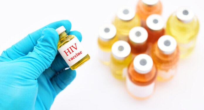 Doctor holding HIV vaccine for injection