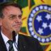 (FILES) In this file photo taken on February 09, 2021 Brazilian President Jair Bolsonaro gestures during the Launch of the "Adote 1 Parque" (Adopt a Park) Program at Planalto Palace in Brasilia. - Bolsonaro apparently ended up admitting that the coronavirus pandemic, which is wreaking havoc in the country, is more serious than a "flu". Though he was seen wearing a mask, ordered millions of vaccines and changed his discredited Minister of Health, observers rule out a radical change of position, as Bolsonaro continues to oppose the confinement measures demanded by scientists to control the disease, which has already left nearly 280,000 dead in the country. (Photo by EVARISTO SA / AFP)